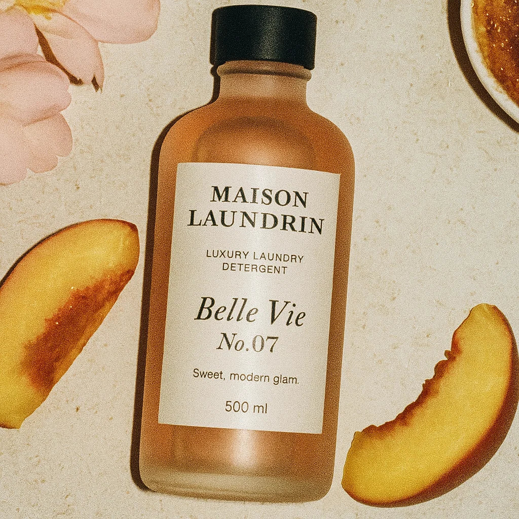 Belle Vie laundry detergent flat lay with peach blossom scent notes